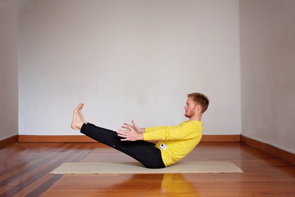 Five Poses to Help Rock Crow Pose - Boat Pose by Paul Giese