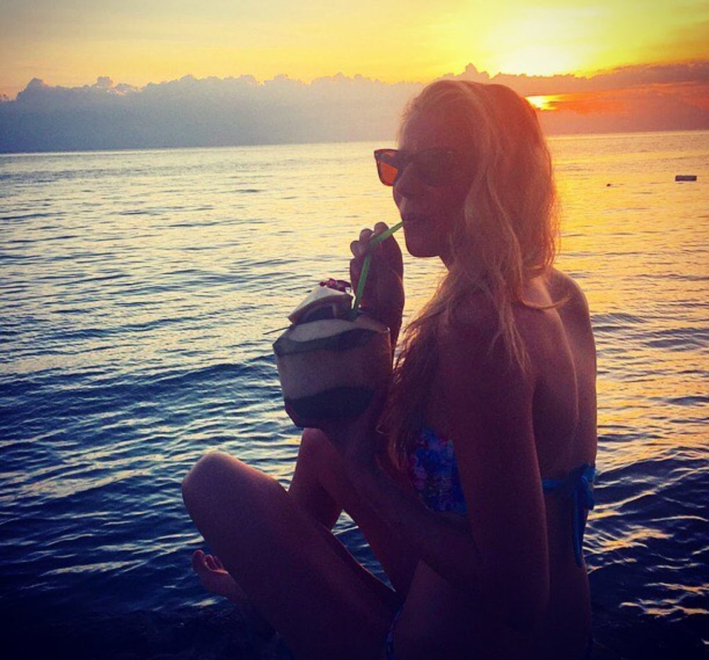 Claudia Gruber Drinking Coconut Water to stay hydrated