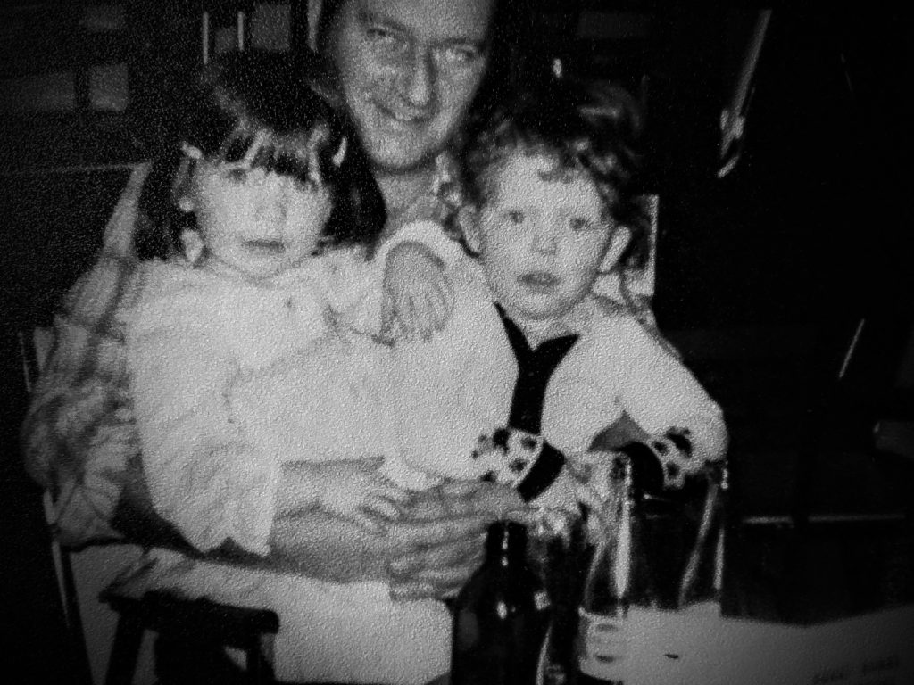 Natasha Mckenty - My brother and I on Papa's lap 