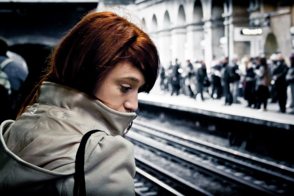 Girl waiting for train by Hernan Pinera