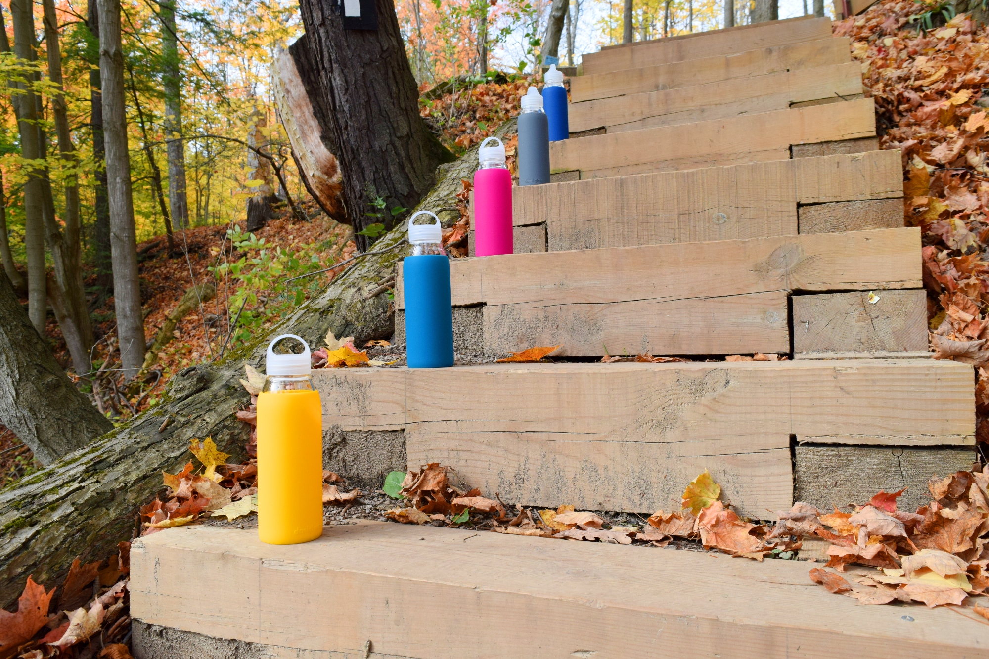 Daniel Glass bottles on wooden stairs
